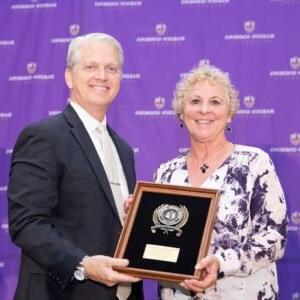 President Bruntmyer presents an award to Dr. O'Connell.